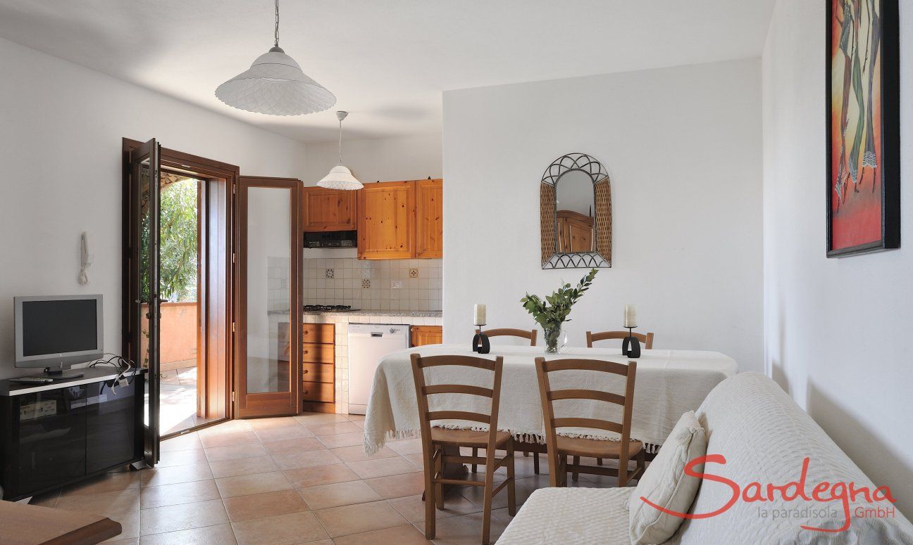 Apartment Castededdu 6 | Salotto con cucinotto, tavolo e angolo divano Salotto con cucina
