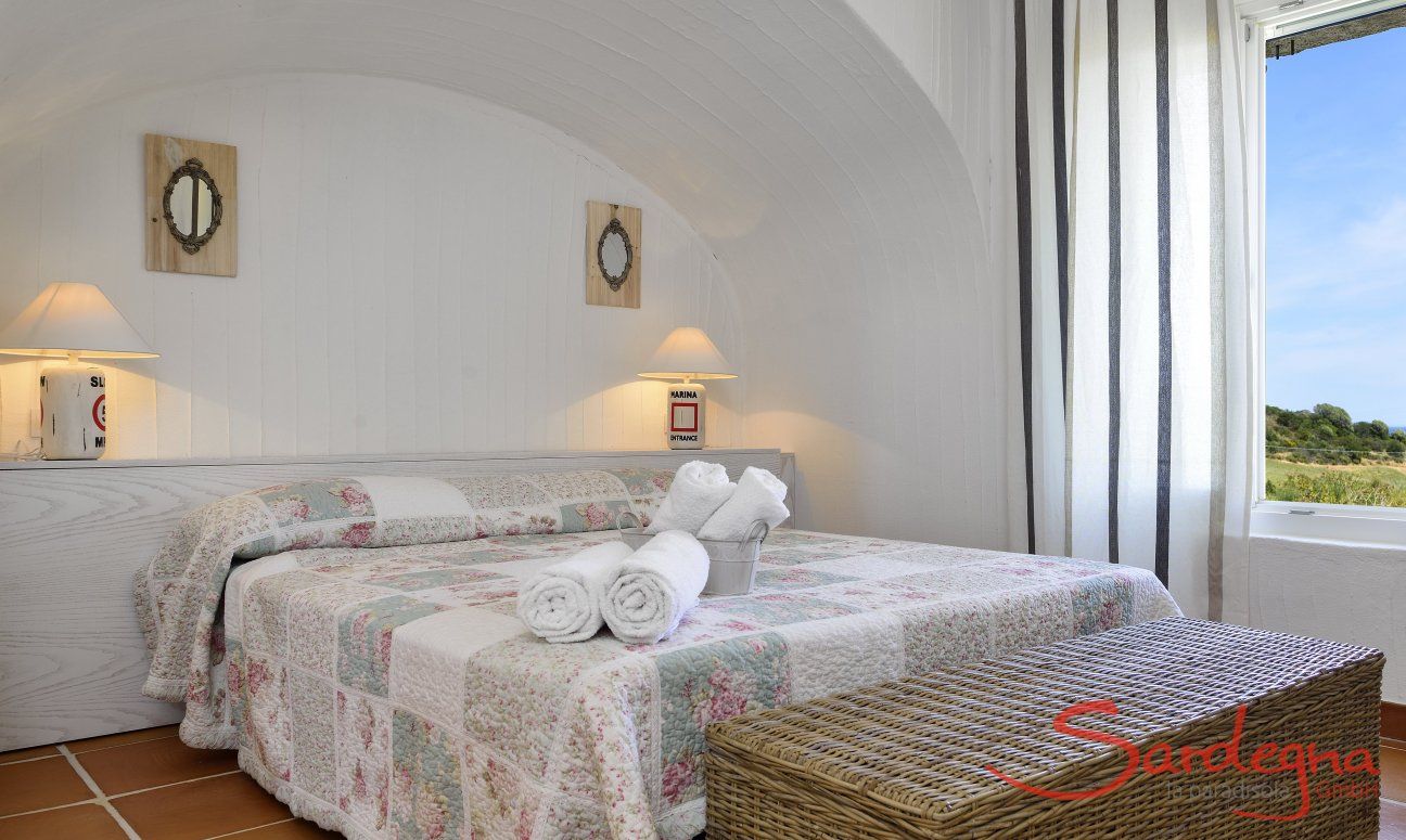Li Conchi 39 | Camera 1 con letto matrimoniale e vista giardino Camera da letto 1
