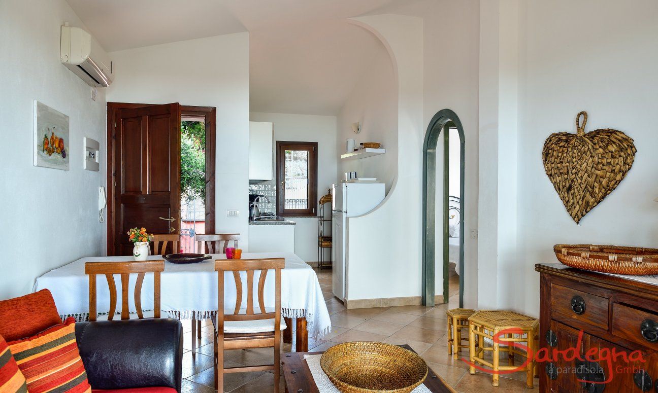 Apartment Castededdu 1 | Sala con zona relax, zona pranzo e angolo cottura Sala