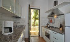 Villetta 12 | Cucina con accesso al giardino Cucina
