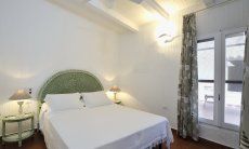 Casa 2 | Su ogni lato del patio si trova una camera con letto matrimoniale Camera da letto