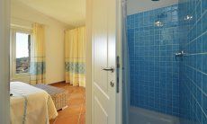 Li Conchi 7 | Bagno 1 con doccia, adiacente alla camera 1 Bagno privato con doccia Li Conchi 7