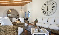 Li Conchi 10 | Angolo Divano Angolo Divano con orologio da muro Li Conchi 10, Cala Sinzias