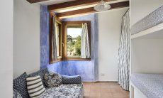 Penthouse Domus 16 | Camera con divano letto e letto a castello Camera con tre posti letto