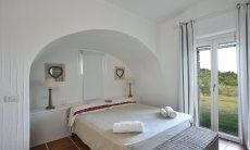 Li Conchi 37 | Camera 2 con letto matrimoniale e accesso al giardino Camera da letto