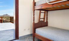Apartment Castededdu 5 | Cameretta con letto a castello e accesso alla terrazza Cameretta
