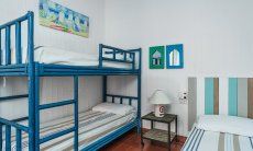Casa 17 | Camera 2 con letto a castello e letto singolo Casa 17, Sant Elmo, Sud Sardegna